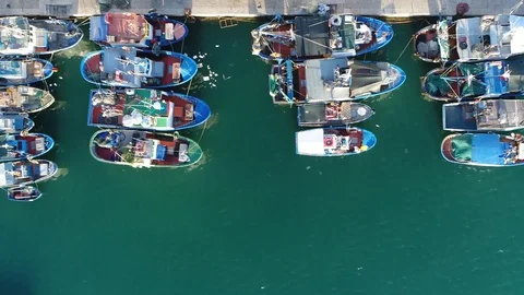 Aerial top down view flight to left over mediterranean fishing harbor 4k Stock Footage 87289008