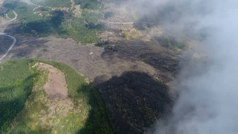 Aerial top down view flight above clouds moving away to right 4k Stock Footage 95590614