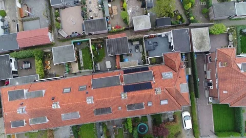 Aerial top down view flying over road moving over typical western neighborhood Stock Footage 74515422