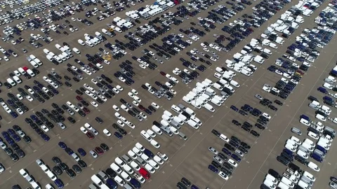 Aerial top down view flying sideways over new car storage parking lot 4k Stock Footage 76313002