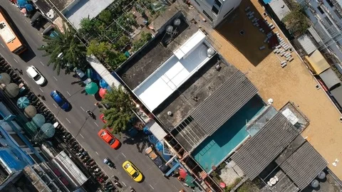 Aerial top down view flying over city showing houses, home, bus, cars. Stock Footage 83937474