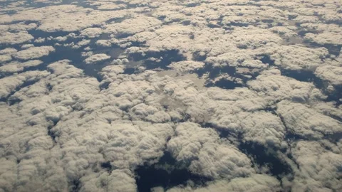 Aerial top down view flying over group of clouds Stockbeeldmateriaal 276700869
