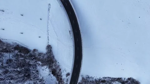 Aerial Top Down View Flying Over Bridge Into Curving Snowy Road 스톡 동영상 329557866