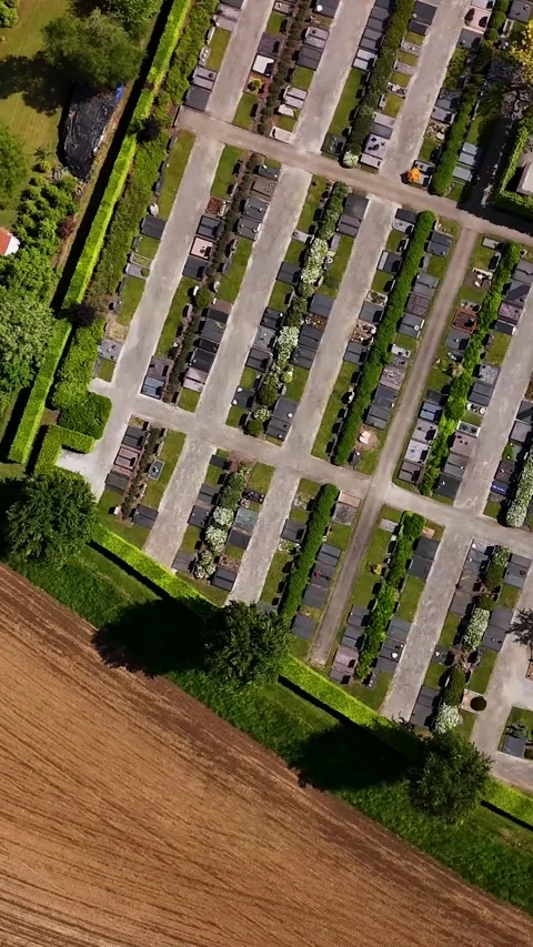 Aerial top-down view flying over a large cemetery 스톡 동영상 336496829
