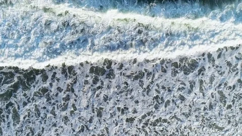 Aerial top down view of foamy ocean surface The Concept of Texture Stock-Footage 327953272