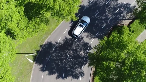 Aerial top-down view following silver grey self driving test car 4k Stock Footage 84326258
