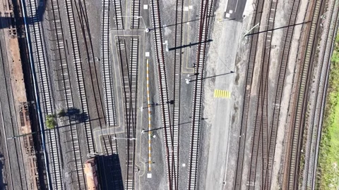 Aerial top down view of freight train moving along railway tracks Stock Footage 340513493