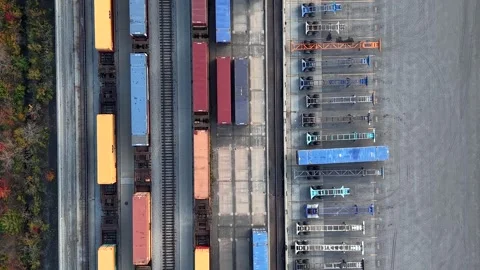 Aerial top down view of freight trains with shipping containers moving Stock Footage 340953047