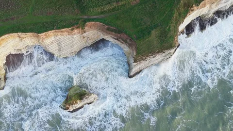 Aerial top down view of Freshwater Bay white chalk cliffs and rocky coastline Stock Footage 336101562