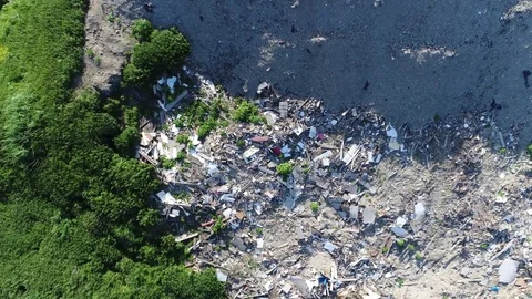 Aerial top down view of garbage recycling yard moving down fast 4k Stock Footage 79969846