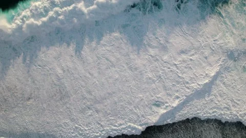 Aerial top down view of giant waves crushing against reefs. Nature of polynesia Stock Footage 164799149