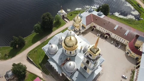 Aerial top-down view of golden domes of Nilov Monastery cathedral Stock Footage 338103479