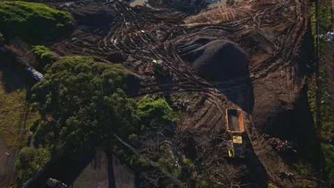 Aerial top-down view of heavy machinery on a construction site Stock Footage 340131084