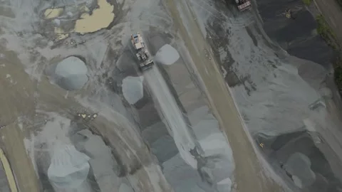 Aerial top down view of a heavy truck in a stone quarry Видео 343844876