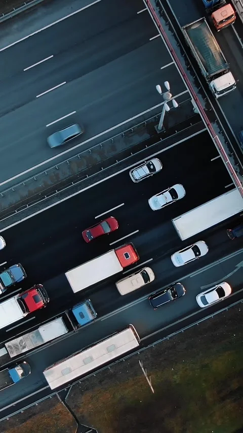 Aerial top down view of heavy traffic jam with cars and trucks driving on a Stock Footage 347598036