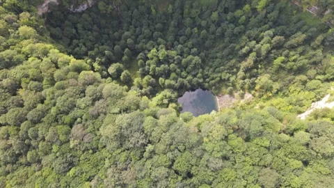 Aerial top-down view of hidden mountain lake Stock Footage 337470266