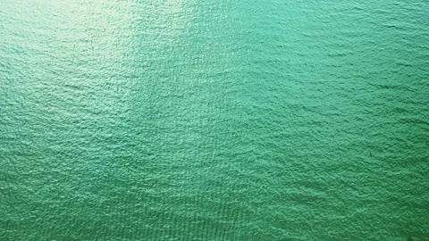 Aerial top down view from high altitude of green sea water texture Stock Footage 160104014