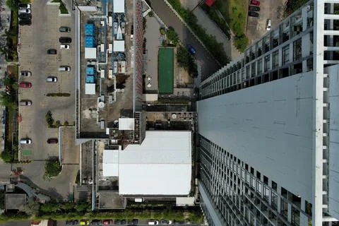 Aerial Top-Down View of High-Rise Skyscraper Rooftop and Urban Infrastructure Stock Photos