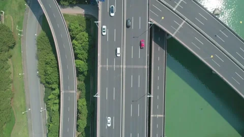 Aerial top down view of a highway overpass multilevel junction with fast moving Stock Footage 166210941
