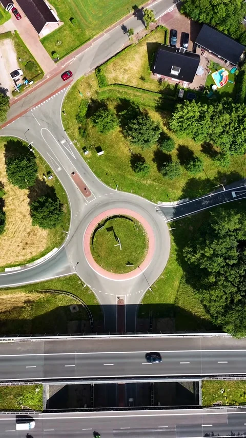 Aerial top down view of highway intersection and roundabout Stockbeeldmateriaal 327110109