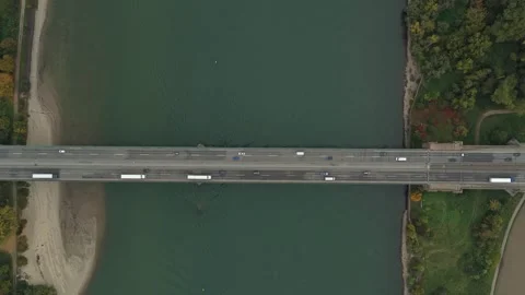 Aerial top down view of highway bridge crossing river with traffic Stock Footage 327602431