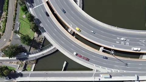 Aerial top down view of highway interchange with curved overpass Stock Footage 332722527