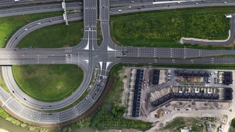 Aerial top down view of highway interchange and residential construction Stock Footage 335975066