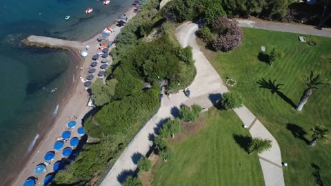 Aerial top down view of hill path and premium resort beach in Greece Stock Footage 343939956
