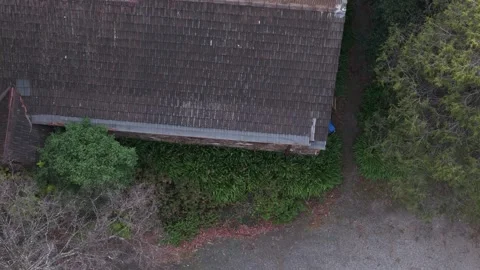 Aerial top-down view of historic stone church with tiled roof Stock Footage 341905103