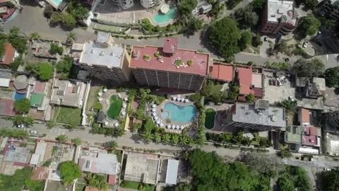 Aerial top down view of hotel resort pool and residential buildings in La Vídeos de archivo 342718810