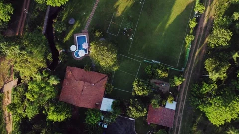 Aerial Top Down View of House, Garden, Swimming Pool and Sports Field Drone 스톡 동영상 321103647