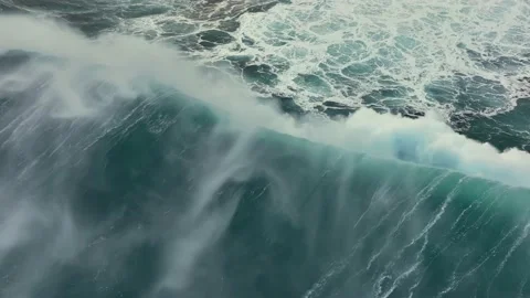 Aerial top down view of huge storm wave crashing on the Atlantic coast. Flying Stock Footage 178945194