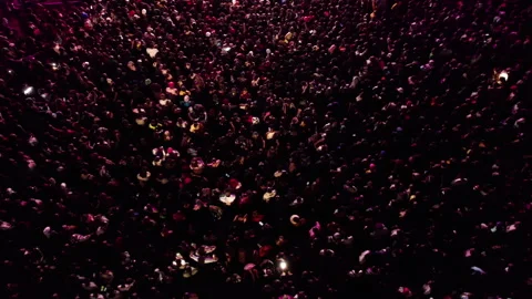 Aerial top down view of  huge crowd of young African people dancing at a concert Видео 346105179