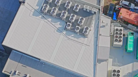 Aerial top-down view of hvac systems on an industrial roof Stock Footage 340572081
