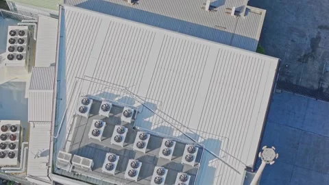 Aerial top-down view of hvac units on a building roof Stock Footage 340579875