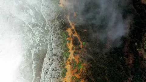 Aerial Top Down View Of Ijen Crater Wall Covered In Morning Mist And Fog Stock Footage 334697865