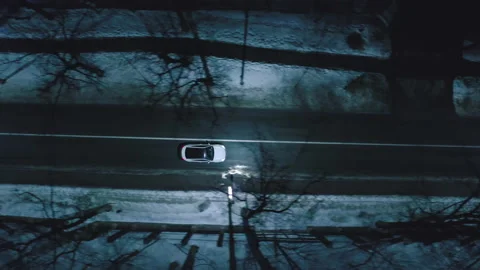 Aerial top down view of illuminated city road at night with car 스톡 동영상 150659866