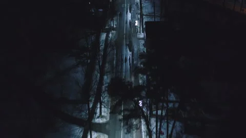Aerial top down view of illuminated city road at night with car 库存影片 150660078