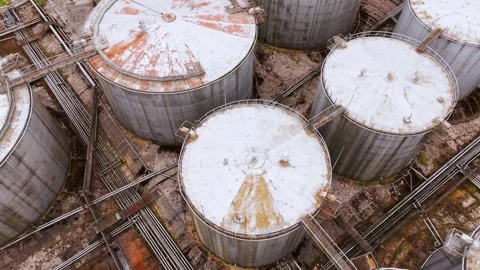 Aerial Top Down View Of Industrial Oil Tanks With Rust And Geometric Layout Stock Footage 335951950