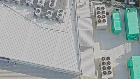 Aerial top-down view of industrial air conditioning units on a rooftop Stock Footage 340576264