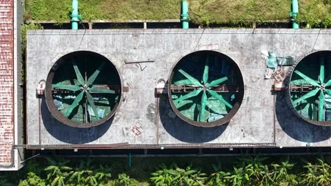 Aerial top down view of industrial cooling tower fans Vídeo Stock 345961349