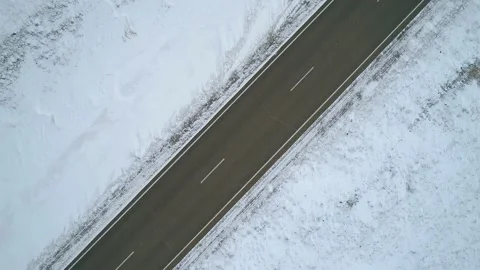 Aerial top down view on an intercity road with a driving car in rural area Stock Footage 153797599