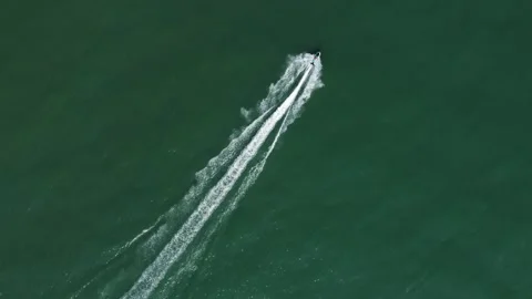 Aerial top down view a jet ski ride in Jomtien beach, Pattaya, Thailand 4K Stock Footage 241569091