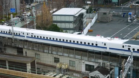 Aerial top down view to the JR railway track way with JR Yamanote train com.. Stock Footage 308994472