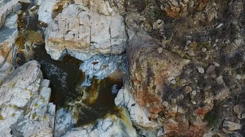 Aerial top-down view of a large waterfall in the desert Stock Footage 71144230