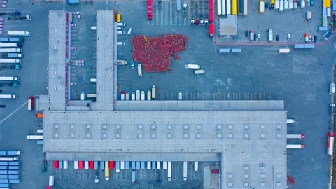 Aerial top down view of the large logistics park with warehouse and semi trucks Stock Footage 125533264