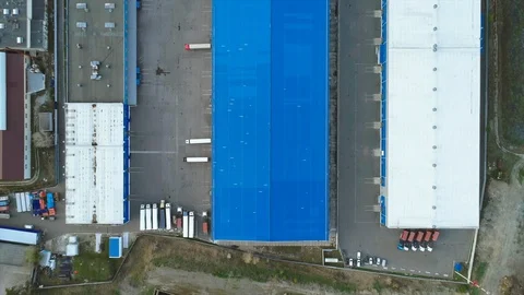 Aerial top down view of the large logistics park with warehouse with some tracks Vídeos de archivo 129053787