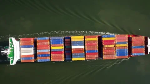 Aerial top down view of large container cargo ship traveling with slow speed. Stock Footage 243556520