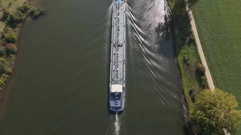 Aerial top-down view of a large tanker navigating a river Stock-Footage 320813302