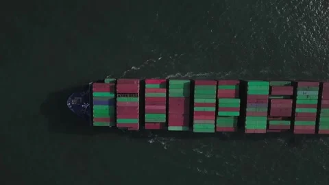 Aerial top down view large container cargo ship traveling with slow speed over Video stock 336446601
